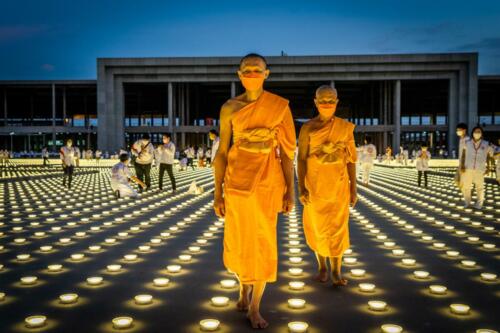 Monks walk through a sea of LED lanterns during the Earth Day 2022 celebration at Wat Phra Dhammakaya Temple. Photographer: Matt Hunt / Neato